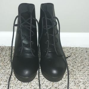 Black laceup high heel boots